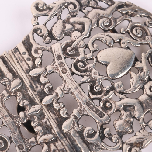 590 - A late Victorian silver nurse's buckle, Saunders & Shepherd, Chester 1897, pierced heart and cherub ... 