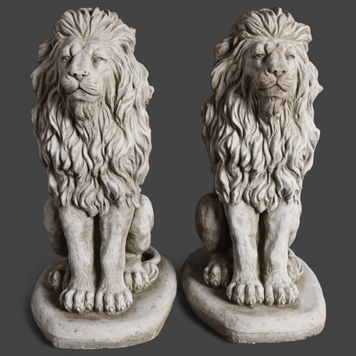 787 - A pair of concrete garden statues, seated Lions, height 40cm.