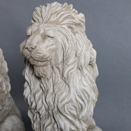 787 - A pair of concrete garden statues, seated Lions, height 40cm.