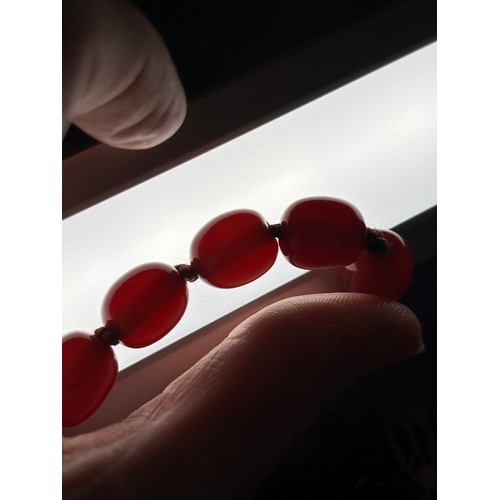 1177 - A Vintage single-strand cherry amber bead necklace, beads measure approx 12.5mm, 70cm, 50.7g