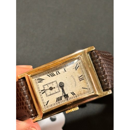 1014 - LONGINES - an Art Deco 9ct gold mechanical wristwatch, circa 1930s, silvered dial with black Roman n... 