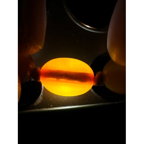 1176 - A group of amber beads, mostly 9.6mm, 8.4g