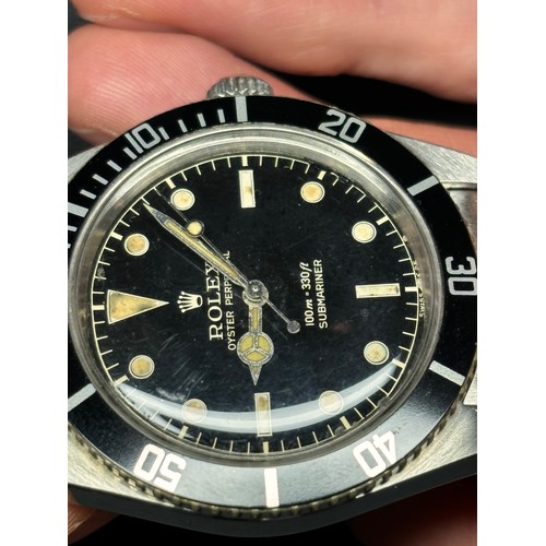 1004 - ROLEX - a Vintage stainless steel Oyster Perpetual Submariner 'James Bond' automatic bracelet watch,... 