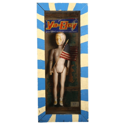 116 - Curiosity/Macabre: Peter Quinnell - 'Ya-Boy' a modern abstract diorama, a doll holding an American f... 