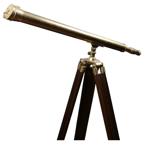 12 - A reproduction brass telescope on telescopic stand