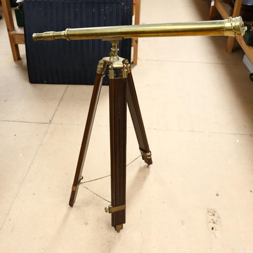 12 - A reproduction brass telescope on telescopic stand