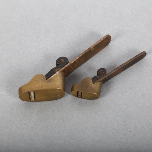 122 - A graduated pair of miniature brass and steel planes, with rosewood infill, small plane sole measure... 