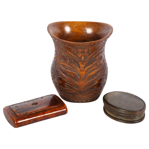 129 - A 19th century treen snuffbox, length 7.5cm, an oval horn snuffbox, and a relief carved wood vase (3... 