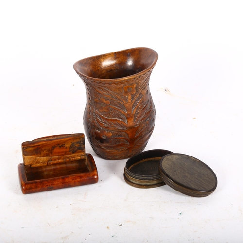 129 - A 19th century treen snuffbox, length 7.5cm, an oval horn snuffbox, and a relief carved wood vase (3... 