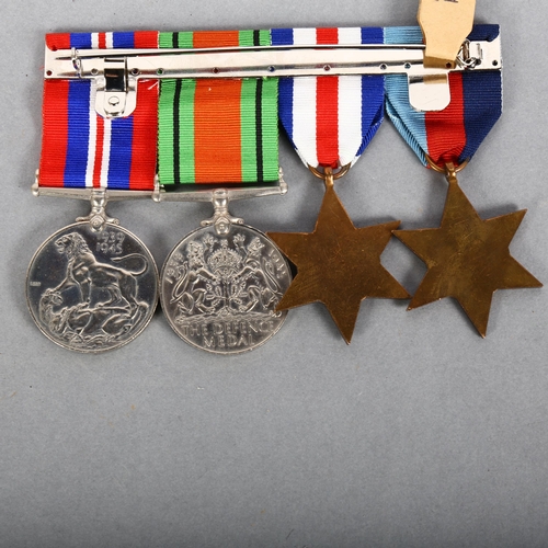 147 - A group of 4 Second World War medals, including a Defence and War medal, a 1939 - 1945 Star, and the... 