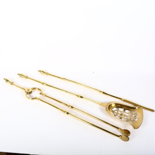 15 - A Victorian polished brass 3-piece fire companion set, comprising tongs, poker and shovel, L79cm