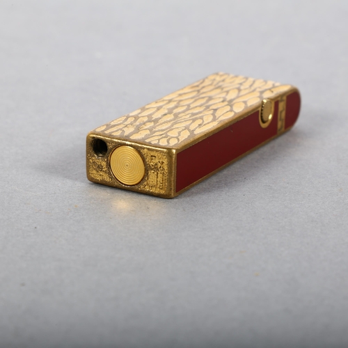 154 - A Vintage Dunhill two-tone lighter with textured body, impressed US.RE 24163 to the underside