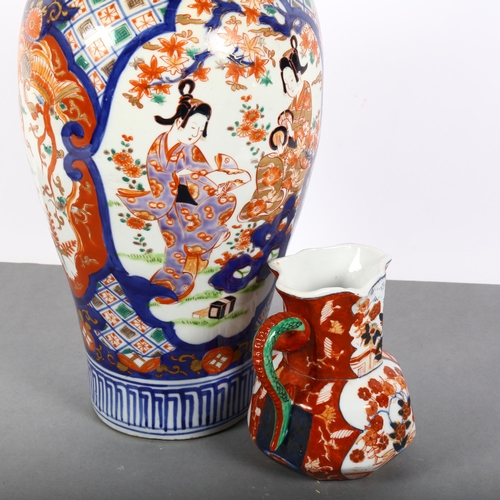 179 - A large Chinese Imari baluster vase decorated with figures, H39cm, and a reproduction Imari jug