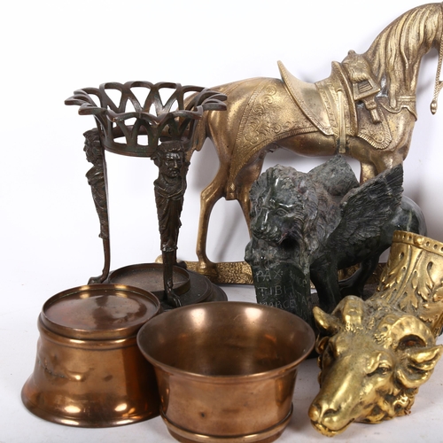 204 - A group of various metalware, including a Classical design brass stand, ram's head mount, pair of br... 