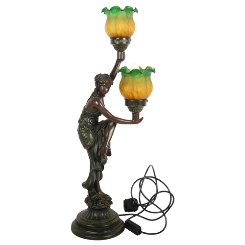 209 - An Art Nouveau design patinated spelter 2-branch table lamp with figural support, with coloured glas... 