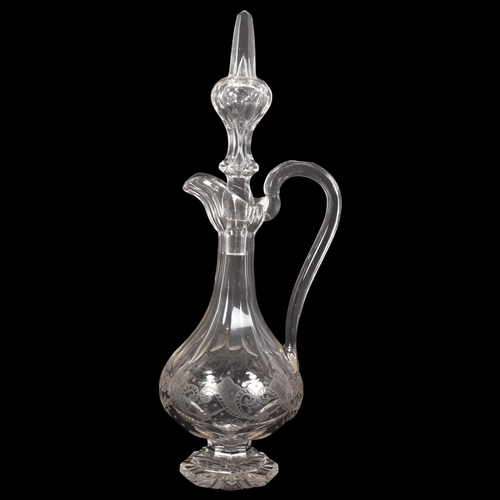 217 - A large glass acid etched and facet cut Claret jug, with matching stopper, H46cm