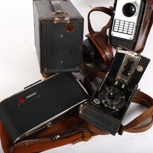 229 - A Bell & Howell 10mm handheld movie camera, with spare lenses, and various other Vintage cameras