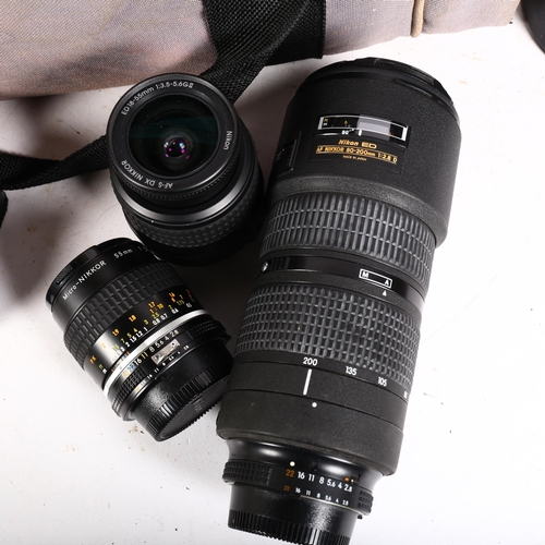 236 - A group of various Nikon lenses and flashes, including a Nikon 80-200mm F/2.8 lens, a 55mm F/2.8 mic... 