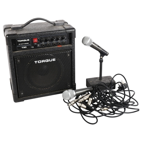 249 - A Torque T30 30 watt combo amplifier, with power cables, and a selection of modern microphones, incl... 