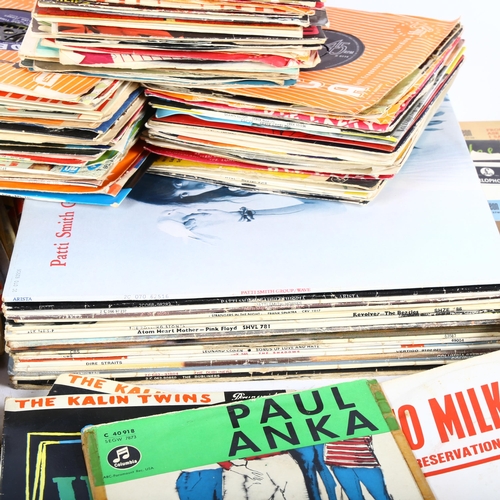 252 - A large quantity of vinyl records, LPs and 7