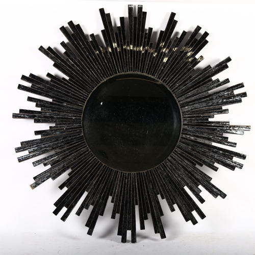 341 - A modern round mosaic sunburst silver and black mirror, and a modern ornate oval mirror (2)