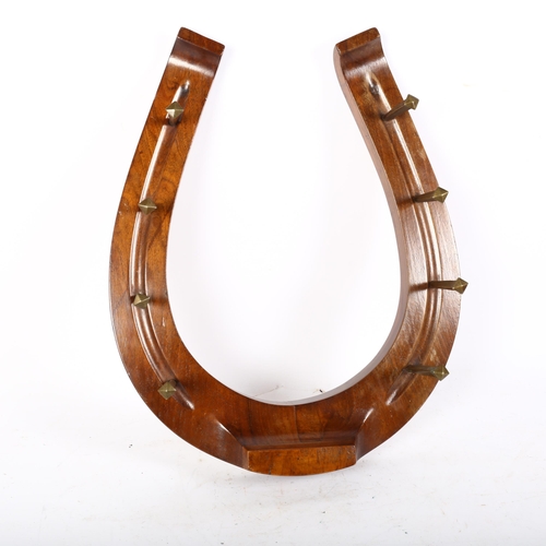 38 - A horseshoe design riding whip rack, H48cm