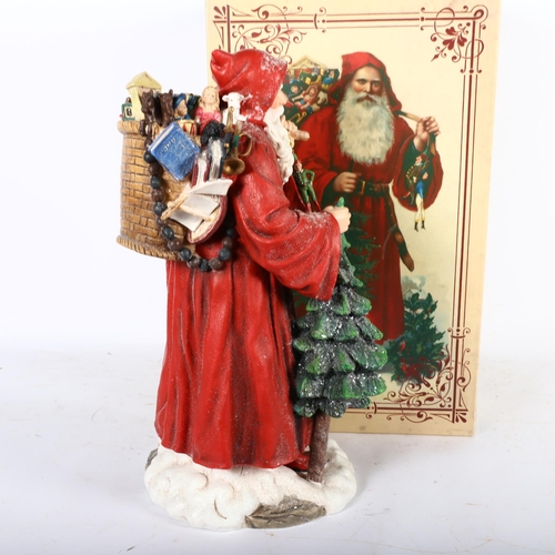 385 - A painted plastic Father Christmas figure with sack of toys, H40cm, new with gift box