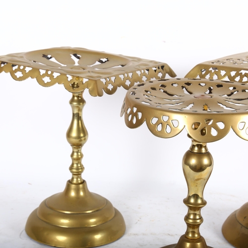 393 - 2 similar Victorian brass trivets with pierced square tops, H25.5cm, and another with circular top