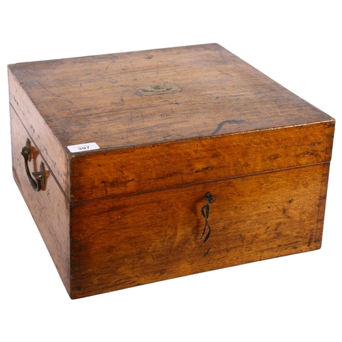 397 - An oak 2-handled box with fitted interior for a silver tea set, with armorial brass plaque to the li... 