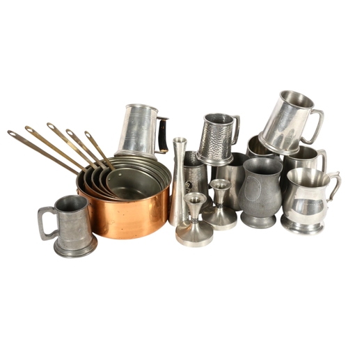 403 - A graduated set of copper pans with brass handles, largest 21cm diameter, assorted pewter mugs, and ... 