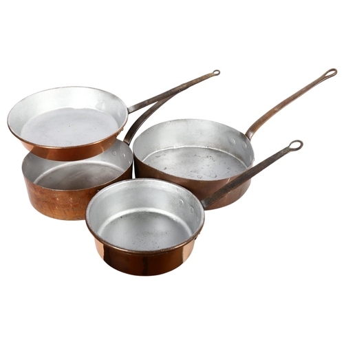 409 - 2 graduated pairs of Antique copper pans with iron handles, largest 36cm diameter