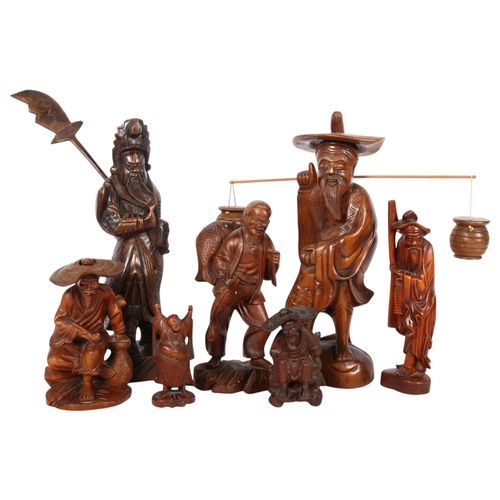 422 - A group of carved wood Oriental figures, including a fisherman with baskets, H30cm, a Samurai figure... 