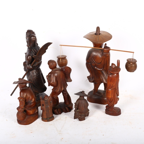 422 - A group of carved wood Oriental figures, including a fisherman with baskets, H30cm, a Samurai figure... 