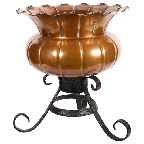 445 - A large Antique lobed copper jardiniere with shaped rim, 45cm across, on wrought-iron stand