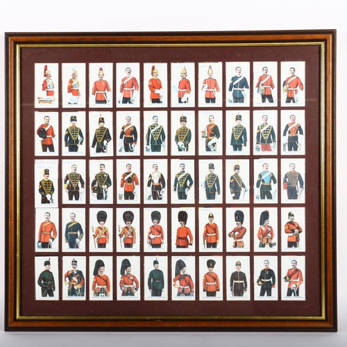 457 - A framed set of British Empire military uniforms, and a set of Ogden's military uniforms, and a Play... 