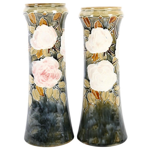 464 - A pair of Royal Doulton tube-lined pottery vases, with designs of roses, 32cm