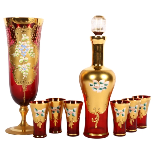 472 - A Venetian enamelled and gilded red glass decanter and stopper, H31cm, 6 matching glasses and a simi... 