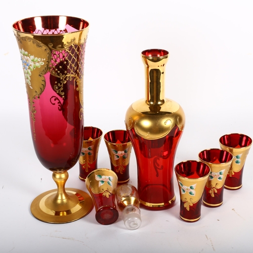 472 - A Venetian enamelled and gilded red glass decanter and stopper, H31cm, 6 matching glasses and a simi... 