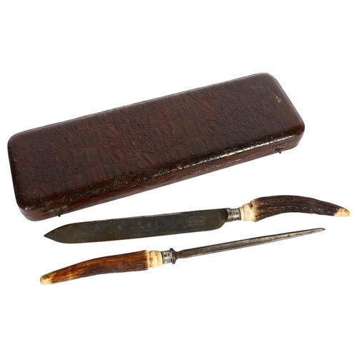 473 - A Mappin & Webb crocodile cased carving knife and steel with staghorn handles