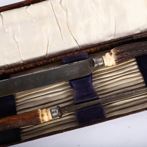 473 - A Mappin & Webb crocodile cased carving knife and steel with staghorn handles