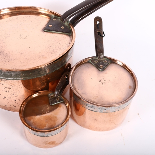 476 - Early 19th century graduated set of 3 copper saucepans with iron handles, and matching lids, all ins... 