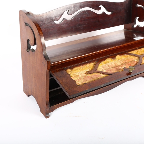 479 - An Edwardian mahogany table-top book rack, with fitted cupboard under, W46cm