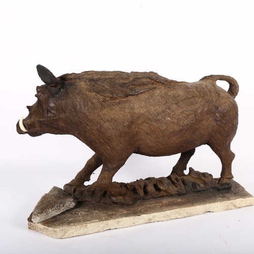 484 - A carved wood sculpture of a wild boar, mounted on stone plinth, H33cm