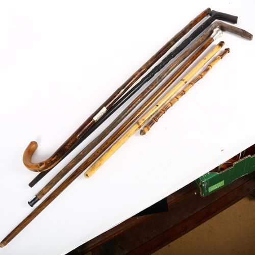 490 - A silver-topped walking cane, London 1920, 2 swagger sticks, and 3 other walking canes