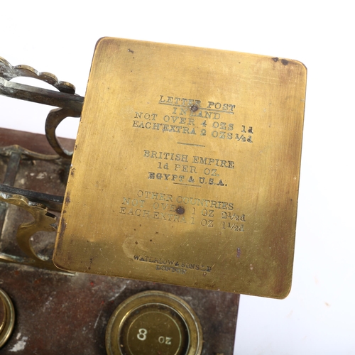 500 - A Victorian brass postal scale and weights, on oak base, L26cm, a cased balance scale with a set of ... 