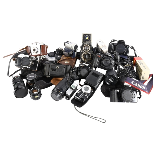 526 - Vintage cameras, including Canon and Kodak, various accessories, etc