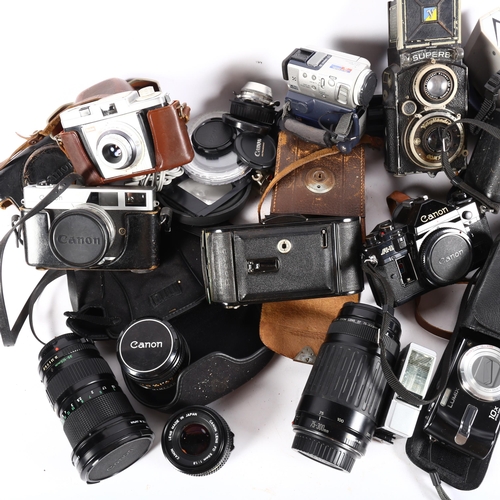 526 - Vintage cameras, including Canon and Kodak, various accessories, etc