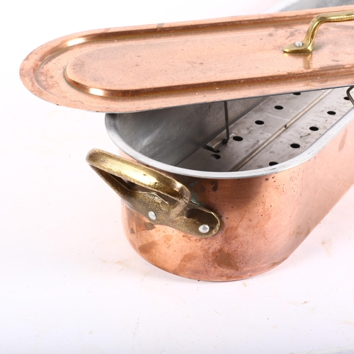 528 - A copper and brass fish kettle, with liner, L68cm overall