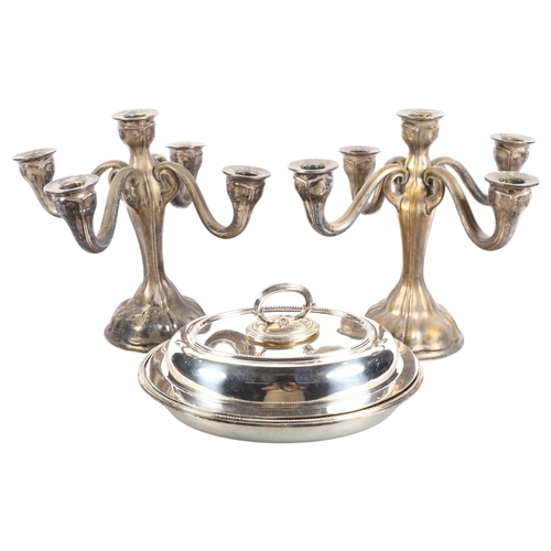 553 - A pair of silver plated 4-branch table candelabras, H27.5cm