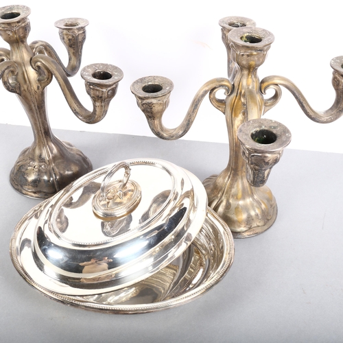 553 - A pair of silver plated 4-branch table candelabras, H27.5cm